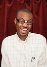 african american nerdy guy with tape on his glasses