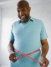 man measuring waistline