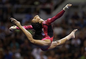 Gabby Douglas at the Olympics 2012 doing a flying split in the air