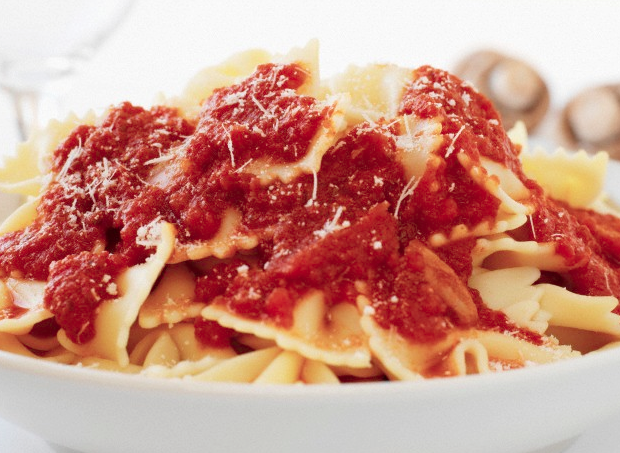 Tomato sauce on top of pasta