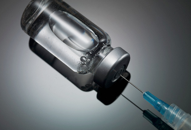 An insulin vial with a needle