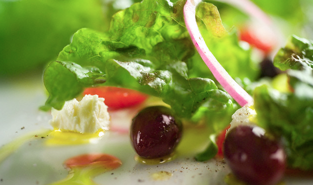 Salad fixings on a white surface