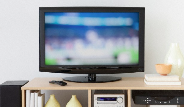 A television sitting on an entertainment stand in the living room