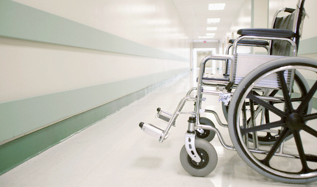A wheelchair sitting in a hospital hallway