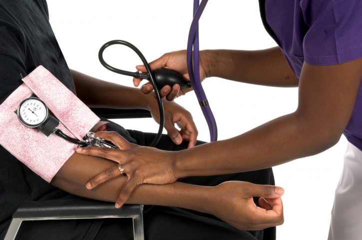 black person getting blood pressure checked