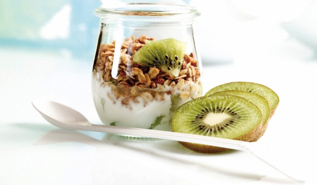 A yogurt and granola in a glass jar