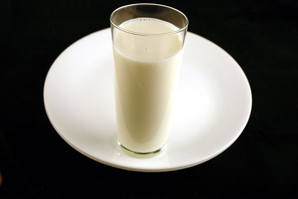 glass of milk on a saucer