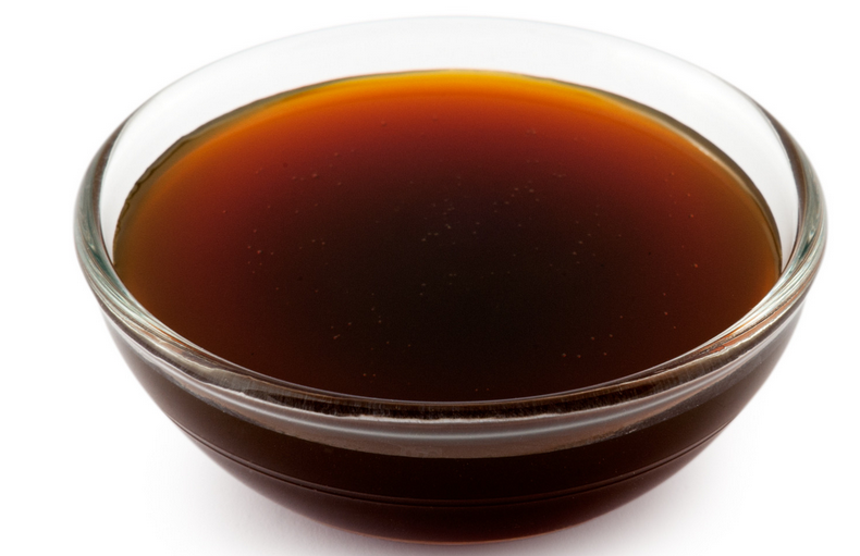 A glass dish filled with yacon syrup