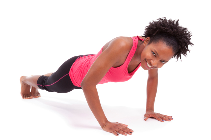 young african american woman doing push ups