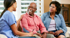 nurse making notes during home visit