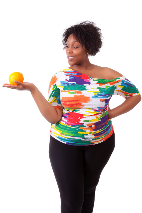woman overweight with fruit