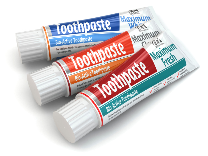 Three packages of toothpaste