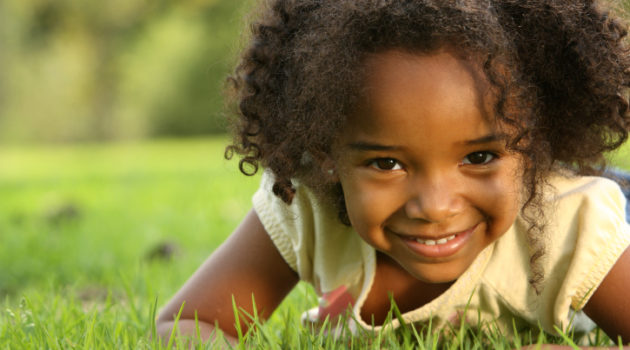 african american girl in the grass