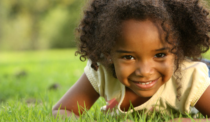 african american girl in the grass
