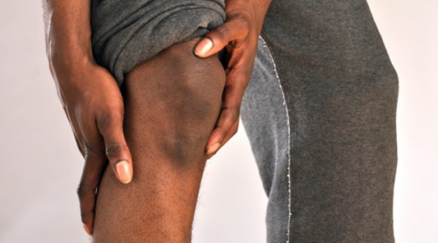 african american man holding knee
