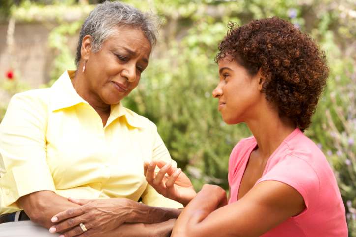 Senior Woman Being Consoled By Adult Daughter