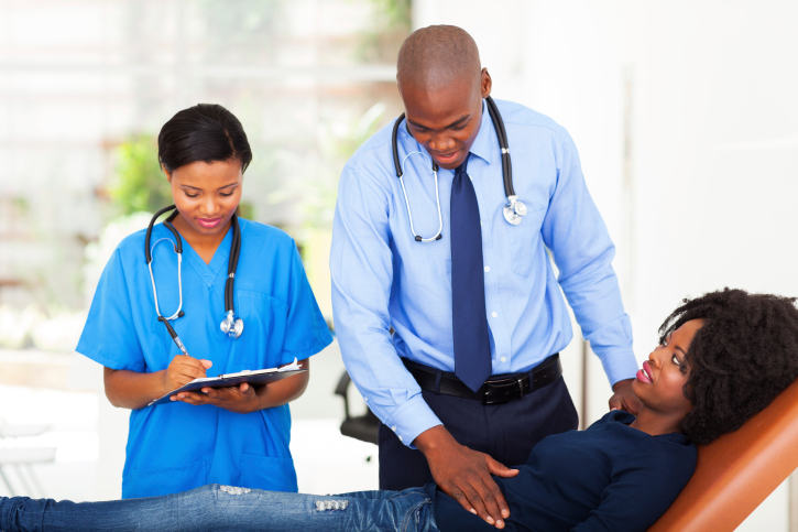 female patient stomach examined