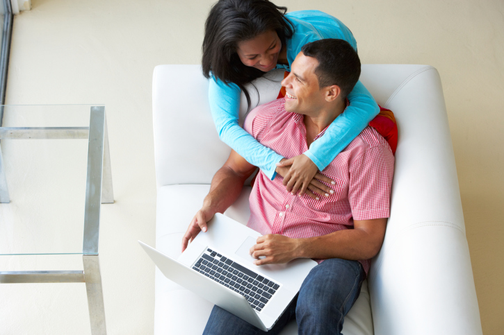 couple on couch computer