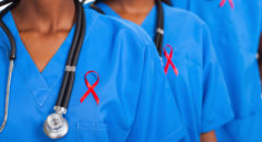 african medical doctors with red ribbon