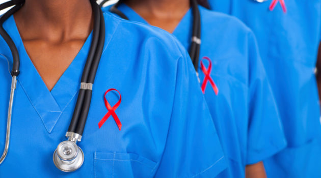 african medical doctors with red ribbon