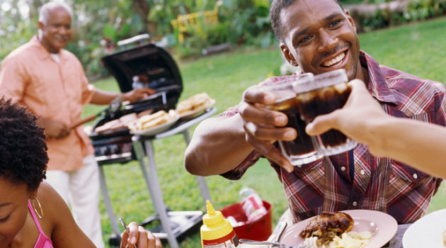 african american man toasting at a barbeque