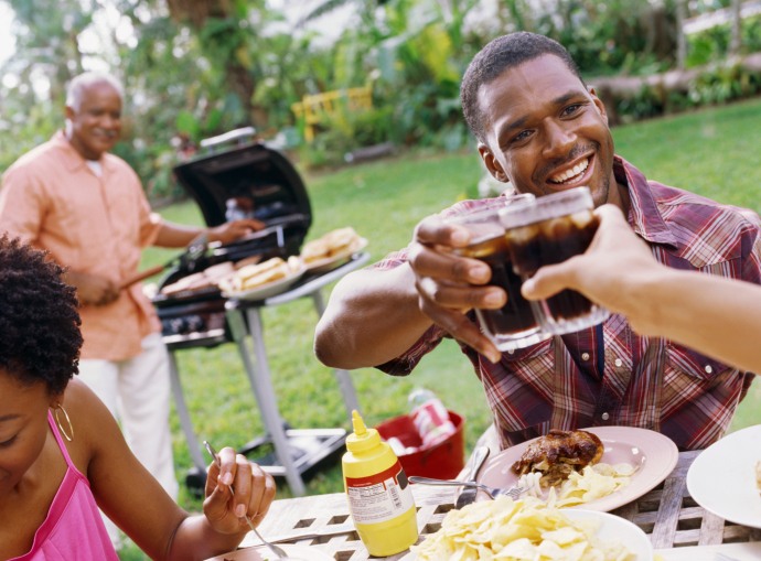 african american man toasting at a barbeque