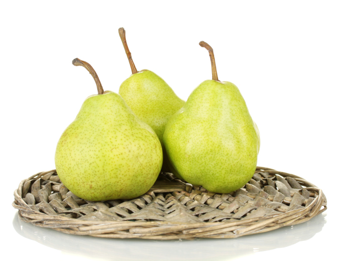ripe pears on a wicker mat