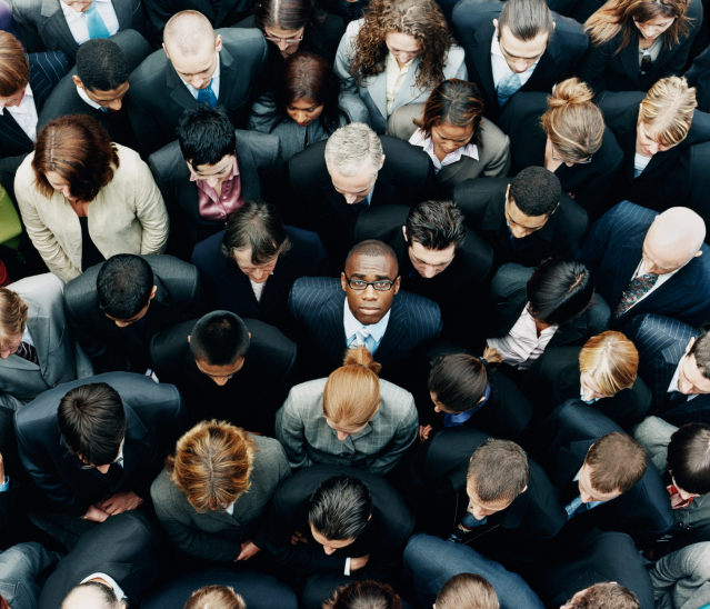 business man looking up in a group of people