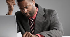Man In Suit Concentrating On Laptop