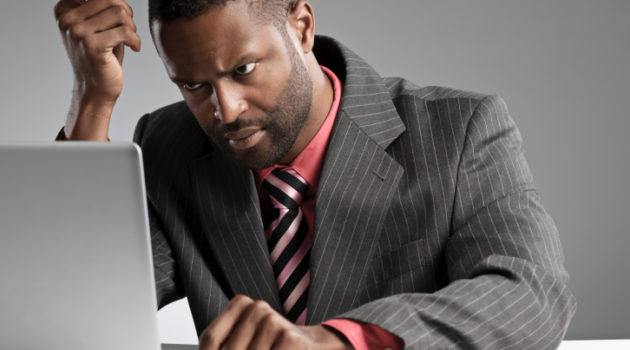 Man In Suit Concentrating On Laptop