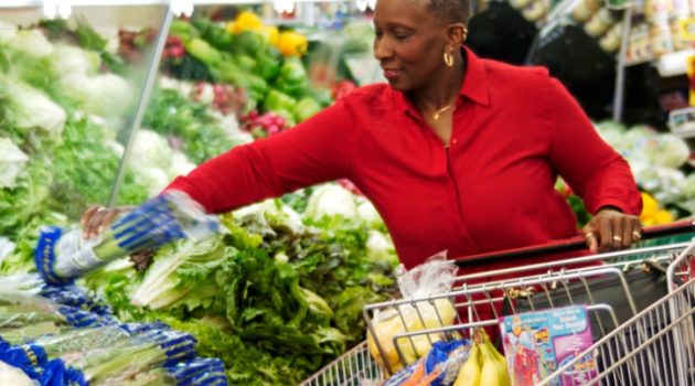 Older African American Black woman grocery shopping