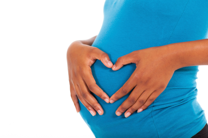 woman holding pregnant belly