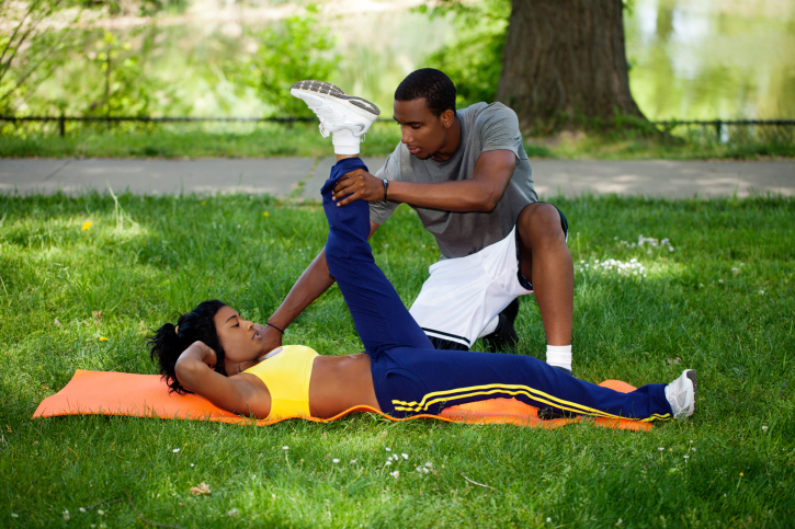 African American Black Couple Working Out In Park On Grass