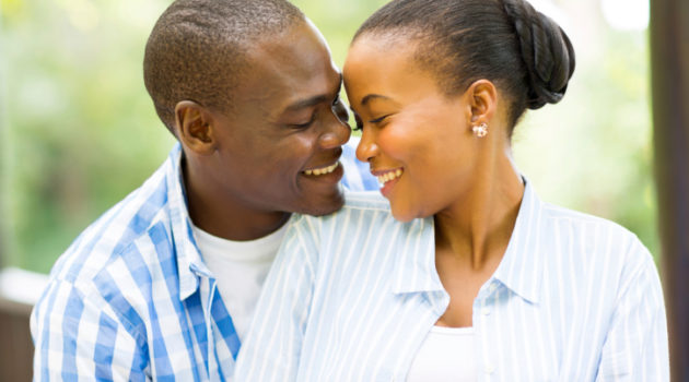 young african american couple looking at each other