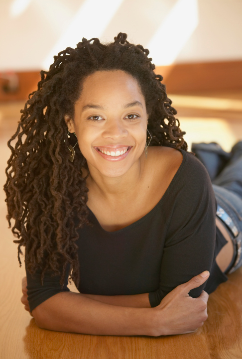 young african american woman smiling to camera