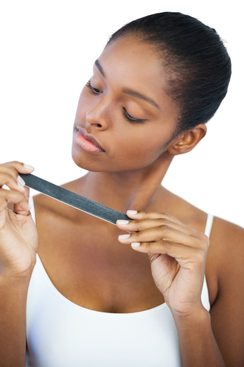 woman examining nail file