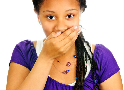 young woman covering mouth