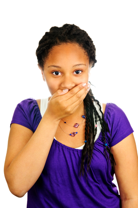 young woman covering mouth