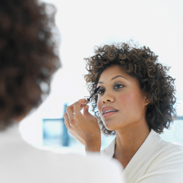 Close-up of a woman applying mascara