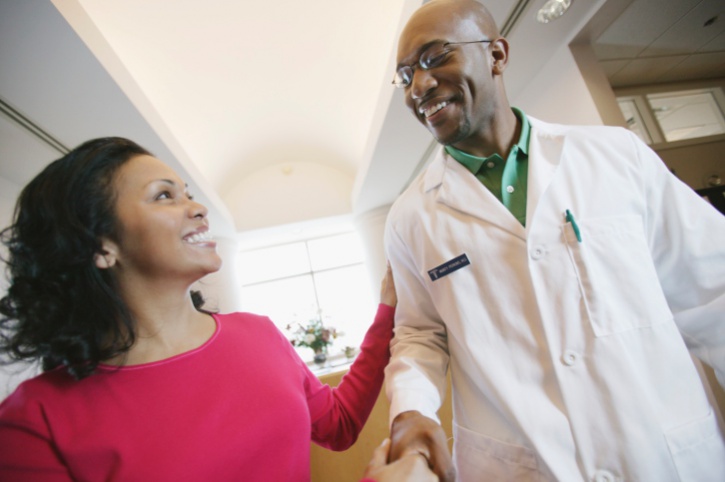 woman shaking doctors hand