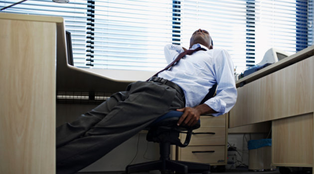 African American Black man bored tired at work office