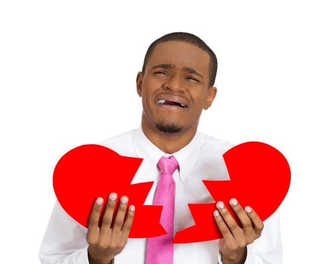man holding broken heart