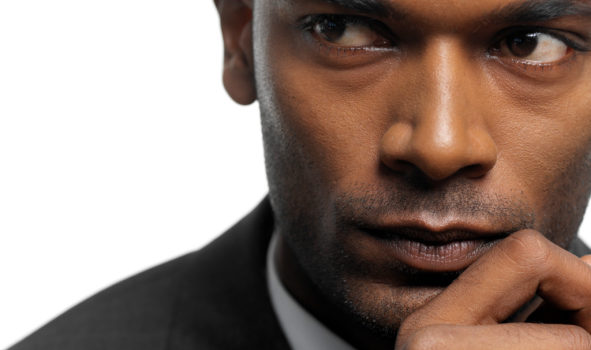 Close-up of a young businessman looking sideways