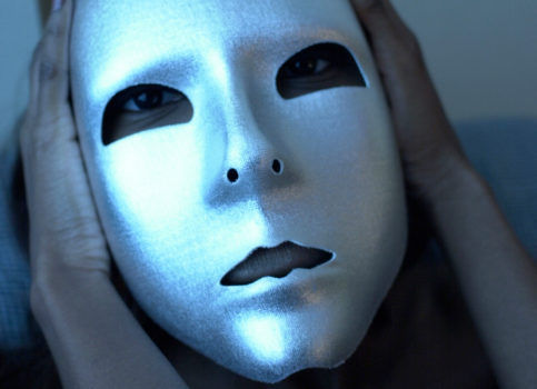 woman holding mask