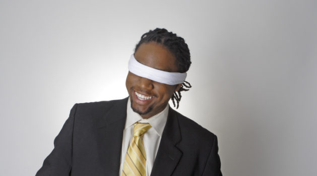 smiling blindfolded african american businessman