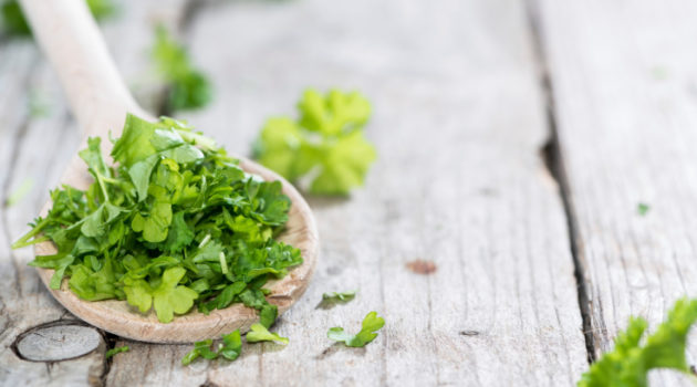 Parsley on a wooden spoon