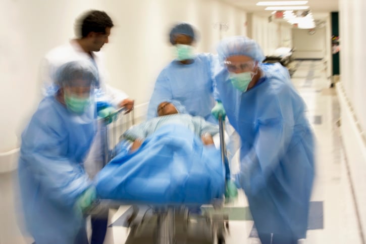 doctors rushing with patient on stretcher