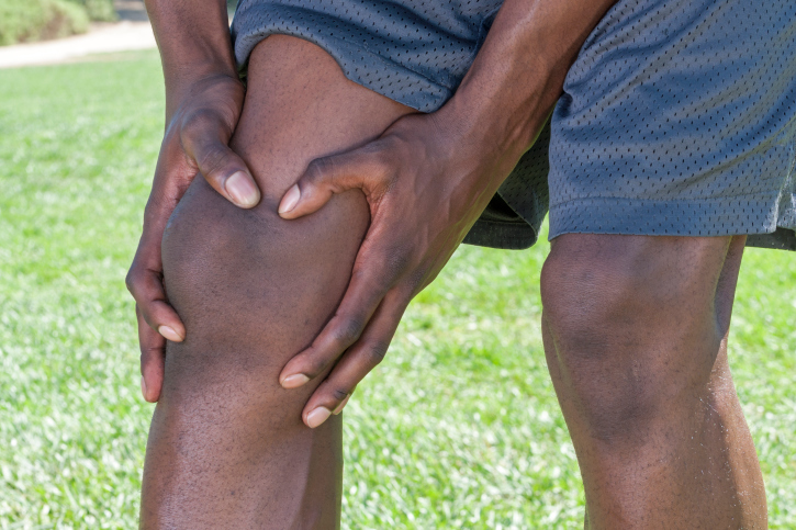 african american man holding knee