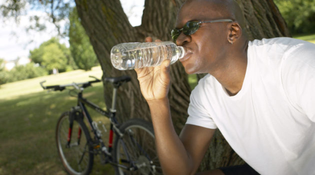african american man drinking water