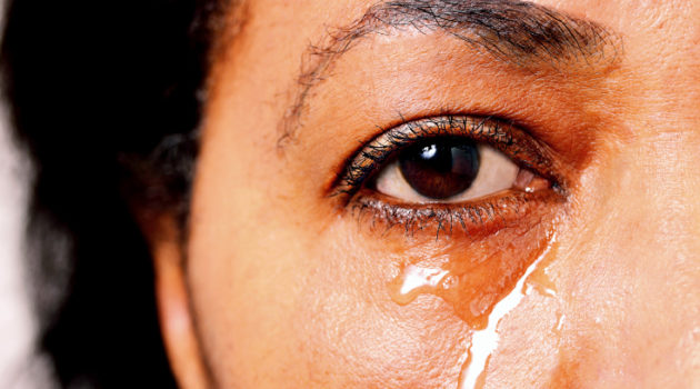 Black woman crying.